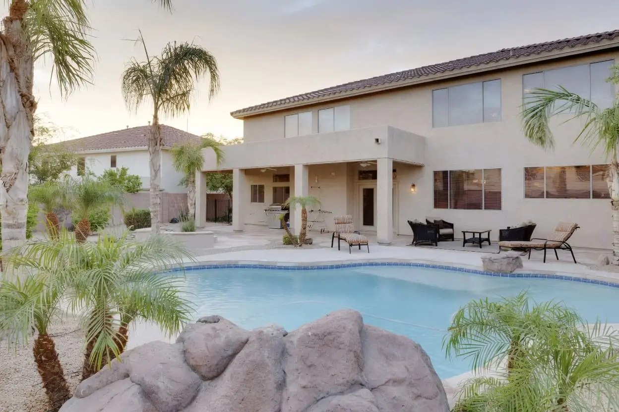 Anti-glare window film installation near a Mesa AZ backyard pool